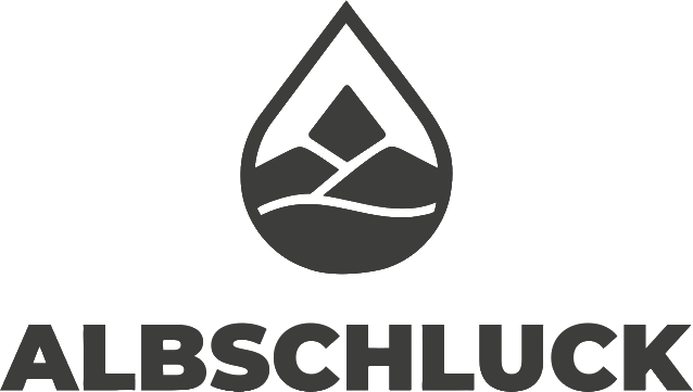 Logo Albschluck Logo von Albschluck, bestehend aus einer Tropfenform und stilisierter Landschaft der Schwäbischen Alb.